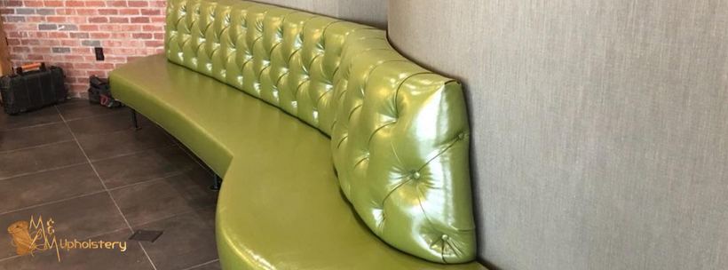 Curved banquettes in navy velvet — upholstered by M&M Upholstery, Dallas