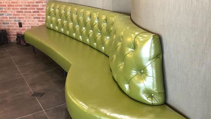 Tufted banquette in green leather — upholstered by M&M Upholstery, Dallas