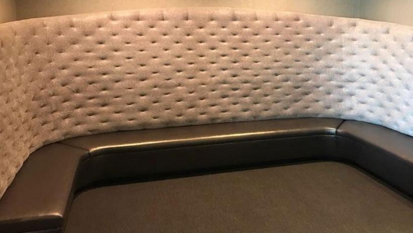 Curved banquette in cream — upholstered by M&M Upholstery, Dallas