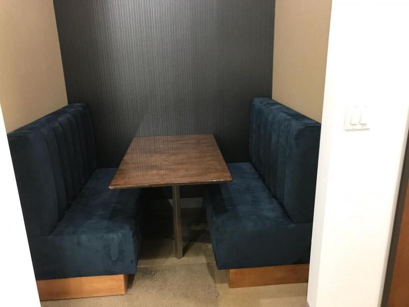 Channel-stitched booths in teal — upholstered by M&M Upholstery, Dallas